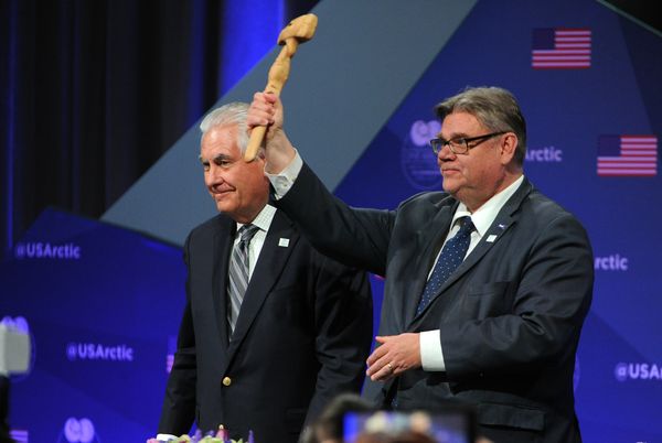 U.S. Secretary of State Rex Tillerson passes the official Arctic Council gavel to the Minister of Foreign Affairs of Finland, Timo Soini, in a ceremony Thursday at the Carlson Center in Fairbanks marking the passage of the chairmanship of the council from the United States to Finland. (Bob Hallinen / Alaska Dispatch News)